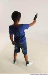 TIMBO STANDING POSE WITH GUN